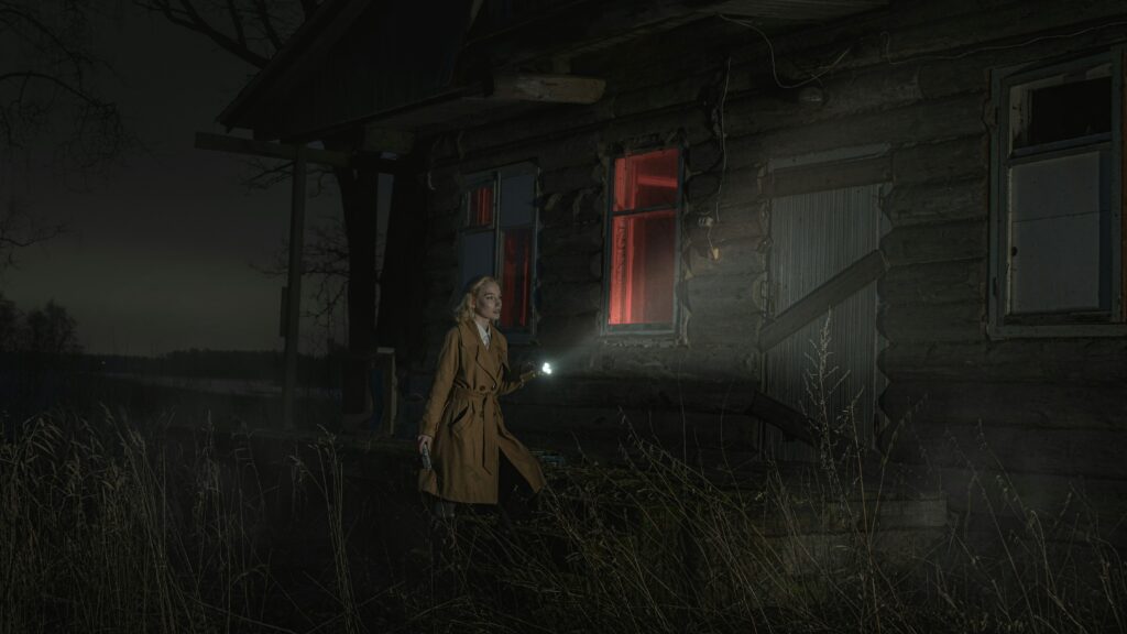 image shows a murder mystery detective with a torch playing murder mystery games