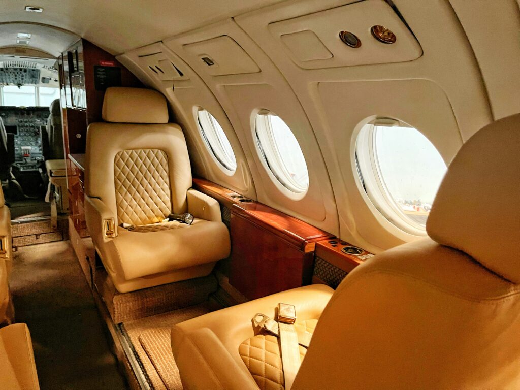 image shows the interior of a private jet plane used in a 1960s murder mystery game