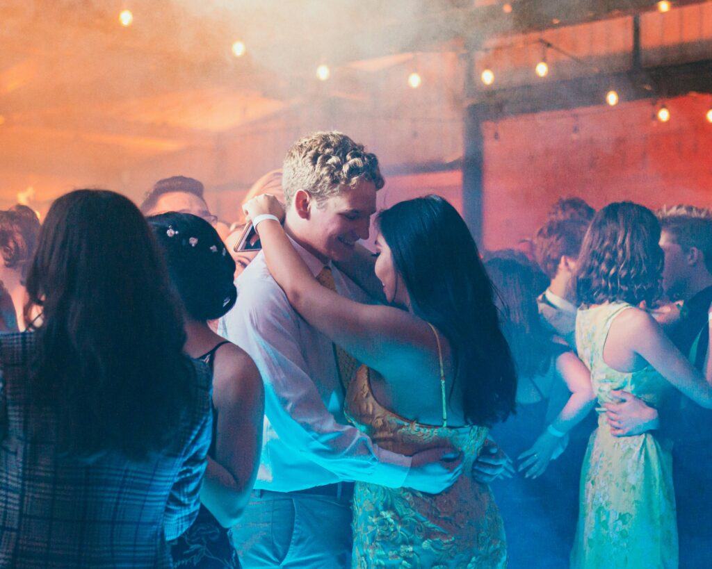 Image shows a high school prom for a prom night murder mystery game